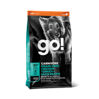 GO! Solutions Carnivore Grain-Free Chicken, Turkey + Duck Recipe for Adults, a high-protein, grain-free dog food specially formulated to support active adult dogs' muscle development and overall well-being.